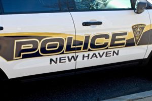 Up close shot of the side of a New Haven police car.